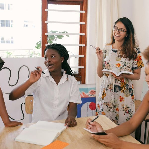 Diverse group of office workers smiling and looking energetic.