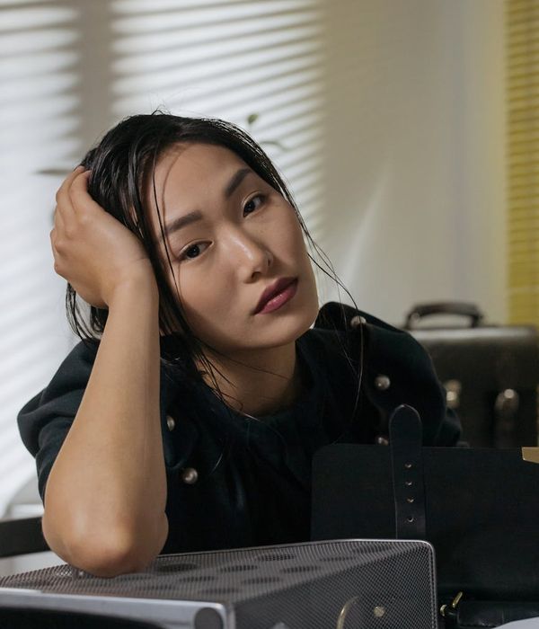 Person sitting calmly at an office desk feeling refreshed and focused.